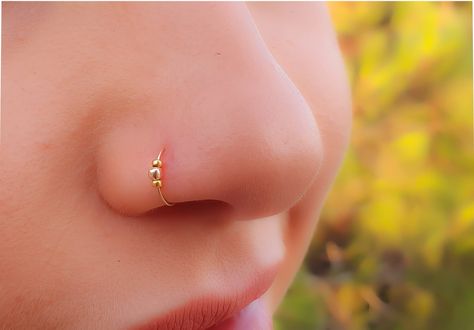 Faux Clip-On Nose Ring 24g - 14K GOLD FILLED - No Piercing Needed ♥ This adjustable nose ring is made of 14k gold filled and can also be used as a fake septum ring ♥ Comfortable, delicate Fake Nose Ring -Nose piercing hoop - 14k gold filled clip Nose Ring. ♥ The Size is adjustable 7 mm Diameter, 24 Gauge. ♥ Comfortable,light-weight and easy to use. Measurements: clip Diameter - 0.3Inch - 7mm Gauge (Thickness of the wire): 0.7mm - 22 gauge ► 100% 14k gold filled ✔ ► we ship all items in a jewelry Tiny Piercings, Tiny Nose Ring, Cute Nose Rings, Nose Ring Designs, Piercings Nose, Unique Nose Rings, Tiny Nose, Faux Nose Ring, Nose Ring Jewelry