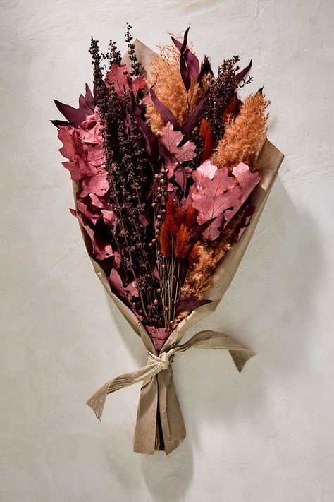 Bring home the hues of harvest season with this dried bouquet, featuring a vibrant mix of oak leaves, flax, willow eucalyptus, pampas grass, bunny tails, and broom corn. Green Fall Wedding Bouquet, Fall Leaf Bouquet, September Florals, Fall Store Window Displays, Autumn Wedding Bouquet, Dried Flower Decor, Green Fall Weddings, Willow Eucalyptus, Fall Thrift