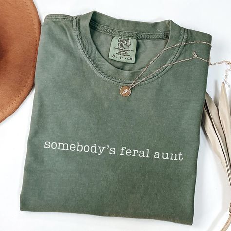 Somebody's Feral Aunt Era Shirt, Comfort Colors Aunt Shirt, Auntie Gifts, Pregnancy Announcement, New Aunt, Sister Gift, Cool Aunt UNISEX T-SHIRTS Comfort Colors Unisex T-shirt - 100% ring-spun cotton (fiber content may vary for different colors) - Medium fabric - Relaxed fit SIZING AND COLORS - Please refer to the size chart in the listing photos for detailed sizing information - For an oversized look, we recommend sizing up two sizes - All products are true-to-fit unisex sizing SHIPPING AND PRODUCTION TIME - Production: 1-3 days - Standard Shipping: 3-5 business days after production time HOW TO ORDER - Choose your shirt color - Choose your size - Verify all order information is correct CARE INSTRUCTIONS - To preserve the design, wash inside out with warm water and mild detergent - Do no Pregnancy Announcement To Sister, Aunt Pregnancy Announcement, Sister Pregnancy Announcement, Cool Aunt, Aunt Shirt, Auntie Shirts, New Aunt, Aunt Shirts, Auntie Gifts