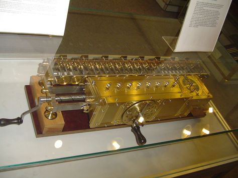 1700: Pre-Steampunk? - The Staffelwalze, or Stepped Reckoner, a digital calculating machine invented by Gottfried Wilhelm Leibniz around 1672 and built around 1700.  It was the first known calculator that could perform all four arithmetic operations; addition, subtraction, multiplication and division. 67 cm (26 inches) long. The cover plate of the rear section is off to show the wheels of the 16 digit accumulator. Mechanical Calculator, Computer History, Library Programs, Flipped Classroom, Industrial Photography, Multiplication And Division, Two Way Radio, Student Created, Astronomer