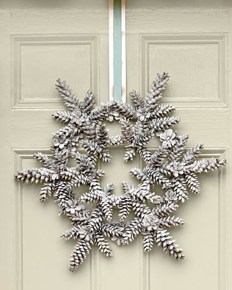 Long, slender pinecones, such as those of a white pine, work best for this DIY snowflake wreath. #christmasdecorations #holidaydecorideas #diywreath #christmaswreath #christmaswreathsdiy #southernliving Christmas Wreath Ideas, Christmas Wreaths Diy Easy, Diy Christmas Wreaths, Homemade Christmas Decorations, Pine Cone Decorations, Cones Crafts, Pinecone Wreath, Christmas Wreaths To Make, Diy Christmas Decorations Easy