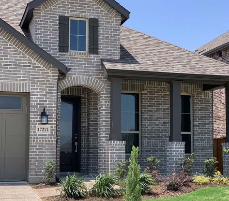 Gray Mist | A medium gray brick excellent for contemporary design | Bilco Brick - Texas Gray Painted Brick House, Gray Brick House Exterior, Grey Brick House Exterior, Brick And Stone Exterior Combinations, Grey Brick Houses, Gray Brick, White Exterior Paint, White Exterior Houses, Exterior House Remodel