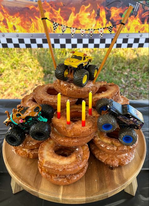 Monster Truck Donut Cake Monster Truck Donut Cake, Monster Truck Birthday Party Cake, Monster Truck Birthday Table Decor, Monster Truck Snacks, Easy Monster Truck Cake, Monster Truck Balloons, Monster Jam Cupcakes, Monster Truck Cupcake Cake, Diy Monster Truck Cake