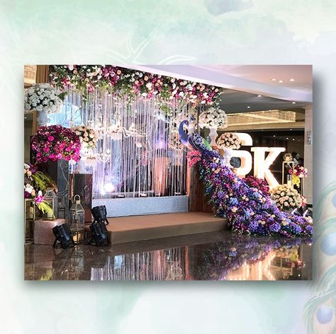 Now here's how you make a lavish statement! Bring a bit of art into your big day with unique installations like this one!  #weddingdecor #decor #decorideas #decorations #weddings #indianweddings #samanidecorators #indianweddingdecor #decorinstallation #peacock #floraldecor #floralideas #bigfatindianweddings Peacock Stage Decoration, Peacock Theme Wedding Decoration, Engagement Theme, Engagement Themes, Wedding Stage Backdrop, Flower Garland Wedding, Wedding Stage Design, Peacock Theme, Desi Wedding Decor