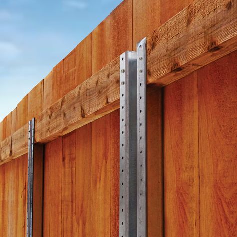 The PROFORCE 7-1/2 ft. Galvanized Steel Fence Posts are made with durable structural steel that can withstand 100 mph hurricane-strength winds. Compare to PostMaster.* The steel posts are galvanized for a thick layer of protection against weather. These steel fence posts are maintenance-free and will not rot or warp over time. Designed for 6 ft. wood fences, installation is made easy with multiple holes predrilled into the posts for easy attachment and eliminating the hassle of needing any additional fittings or hardware. Proforce 7-1/2-ft H x 3-in W Galvanized Steel Privacy Line Fence Post in Gray | 901123A Different Style Fences, Wood Fence Black Metal Posts, Fence For Trash Cans, Fance And Gate Design, Wood Fence Over Chain Link, Diy Wood Fence Cheap, Wood Fence Styles, Hog Wire Fence Ideas, Fences And Gates Modern