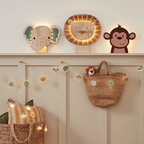 Transform your child's room into a real adventure with our set of safari themed children's lights! 1 x lion wall light; 1 x elephant wall light; 1 x monkey wall light; 1 x 12 LED wooden safari fairy lights; 1 x 12 LED acrylic safari fairy lights; remote controlDimensions: Lion (H) 35 x (W) 36.5cm; Elephant (H) 25.6 x (W) 35cm; Monkey (H) 25.5 x (W) 35cmDimensions of fairy lights: The fairy lights are each 1.65m long with a 0.5m lead to the battery compartmentTotal of 12 x AA and 3 x AAA batteries (sold separately); Wall lights and fairy lights including 6 hour timer functionExclusive to Lights4funThis beautiful ensemble includes a lion wall light, an elephant wall light, a monkey wall light, wooden safari fairy lights and acrylic safari fairy lights.This set will undoubtedly add magical li Lion King Bedroom, Lion Bedroom, Safari Baby Room, Safari Bedroom, Lion Decor, Lion Nursery, Childrens Night Light, Monkey Wall, Childrens Bedroom Decor