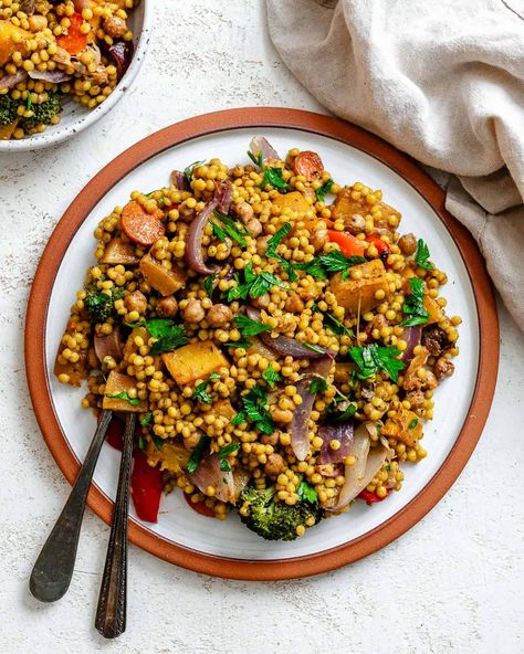 Embrace fall with this easy roasted pumpkin couscous salad with mixed roasted veggies, pepitas, & dried cranberries! A satisfying dairy-free, vegan fall salad! #plantbasedonabudget #pumpkin #couscous #salad Vegan Fall Salad, Pumpkin Couscous, Salad With Roasted Veggies, Roast Pumpkin Salad, Mediterranean Couscous, Cold Salads, Pumpkin Salad, Plant Based Recipes Dinner, Fall Salad