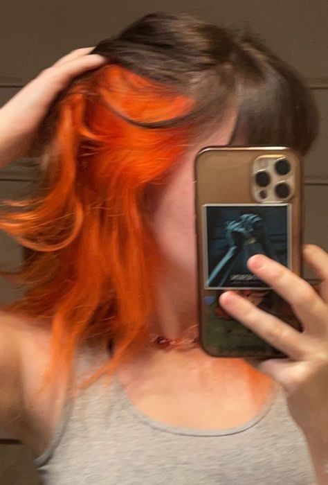 Black Hair Orange Underneath, Brown Hair Orange Peekaboo, Bright Orange Hair Dark Roots, Half Brown Half Orange Hair, Neon Orange Highlights, Orange Peek A Boo Hair, Flame Underdye Hair, Light Brown Hair With Blue Underneath, Brown And Ginger Peekaboo Hair