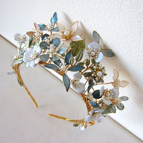 This handmade, gold-plated headdress is woven with mixed-media flowers, crystals and beading. Attach to the head by stringing provided elastic ribbon through loops at the back. The size is adjustable and the wires are malleable to create a variety of looks. Height at tallest point: 6cm Magpie Hoard, Tulle Crafts, Fascinator Hats Wedding, Blue White Weddings, Headband Crown, Medieval Wedding, Crown Gold, Head Wreath, Bridal Headdress