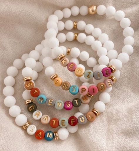 CUSTOMIZABLE Frosted white glass beads with gold rings and colorful letters; add letters, initials, or words Clay Beads Bracelet Ideas With Letters, Wax Bead Bracelet Ideas, Letter Beaded Bracelets, Name Clay Bead Bracelet, Diy Letter Bracelets, Beaded Word Bracelet, Glass Bracelet Ideas, Glass Beaded Bracelets Ideas, Glass Beads Bracelet Ideas