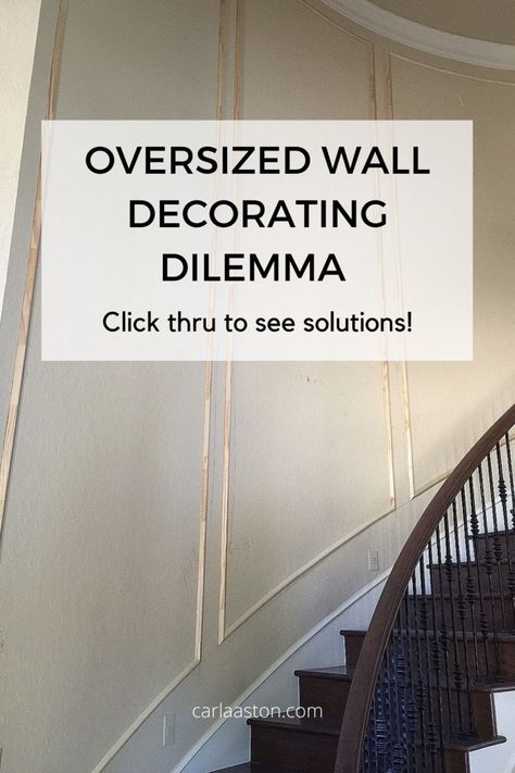 Oversized, awkward wall spaces can look especially bare if not treated somehow. Use trim moulding to help break up the big wall space and then you don’t HAVE to buy a bunch of big art pieces or lay out a complicated gallery wall. See more examples by linking through. carlaaston.com Wallpaper Staircase Wall, Large Stairway Wall Decor, Big Art Pieces, Stairwell Wall Ideas, Stairway Wall Decor, Stairs Wall Decor Ideas, Stair Wall Decor, Wall Molding Design, Stairwell Wall