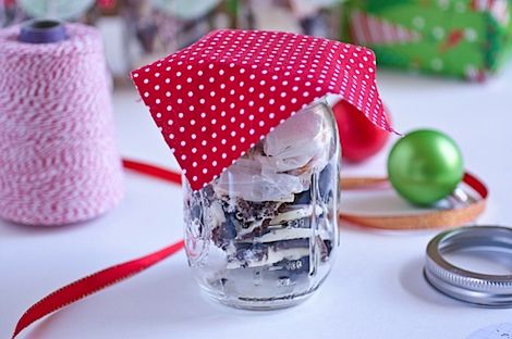 Cut a square out of some fun fabric. You want the square to be a little larger (by about 1 – 1 1/2 inches on each side) than the mouth of the jar. Some of the fabric will be covered by the top ring of the jar, so when you’re measuring, be sure to take that into account. My jar is medium sized, and my fabric is about a 5 inch square. For your first jar, just cut one square as your test square, screw on the top ring and see if you like how it looks. Adjust fabric size if needed. Jar Decoration, Holiday Mason Jar, Fun Fabric, Jar Diy, The Jar, Jar Gifts, Mason Jar Diy, Canning Jars, Preserving Food