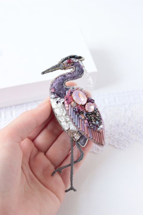 "Buy the Embroidered bird pin as a Gift for wife or Shawl pin. The body of Sweater brooch has a size app. - 3*2 inches (5*8 cm). Heron brooch is carefully bead embroidered on leather with crystals, chenille. Japanese seed beads, metallic beads, and gimp. * Bird Jewelry Size: approx. 2*4,7 inches (5*12 cm) with paws. * Brooch clasp is affixed and sewn on - keeps very tight - - - - *SHIPS WORLDWIDE * - - - - - Just click the \"Buy it now\" and Embroidered bird pin will be tenderly wrapped and trav Embroidered Pins, Beaded Bird, Embroidered Birds, Embroidery Accessories, Embroidered Brooch, Insect Jewelry Design, Embroidered Bird, 5 Elements, Bird Beads