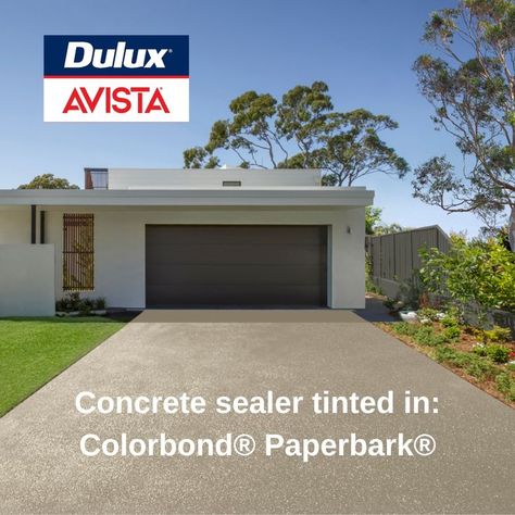 Did you know you can match your concrete driveway to your steel roof or fence – while sealing the concrete for lasting good looks? Dulux Avista now offers four Colorbond® Sealer Tints. Choose from bold and trendy Monument®, timeless Woodland Grey® or the coastal vibes of Shale Grey™ and Paperbark®. Sealers are essential to keep concrete looking good for longer, but why not add some serious style at the same time? This is a fast, affordable way to create a cohesive look for your home's exterior. Plain Concrete Driveway, Driveway Paint Colors, Coloured Concrete Driveway, Concrete Driveway Sealer, Driveway Paint, Cement Driveway, Aggregate Driveway, Colorbond Roof, Concrete Floor Coatings