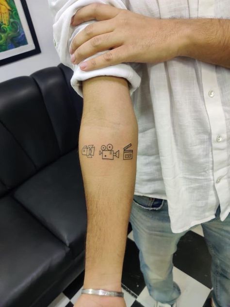 Film Tattoos Ideas, Film Clapper Tattoo, Small Tattoos Camera, Video Editor Tattoo Ideas, Videography Tattoo Ideas, Lights Camera Action Tattoo, Film Tatoos Ideas, Small Film Tattoo, Videographer Tattoo Ideas