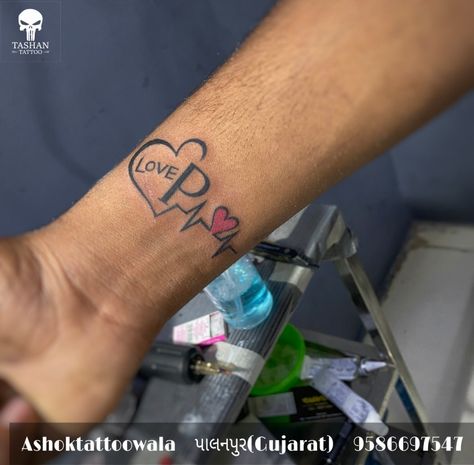 Love p heart tattoo || P With Heart Tattoo, P Heart Tattoo, P Name Tattoo, N Heart Tattoo, Tattoos For Guys Wrist, Heart Tattoo Hand, Couple Name Tattoos, N Heart, Name Tattoo Design