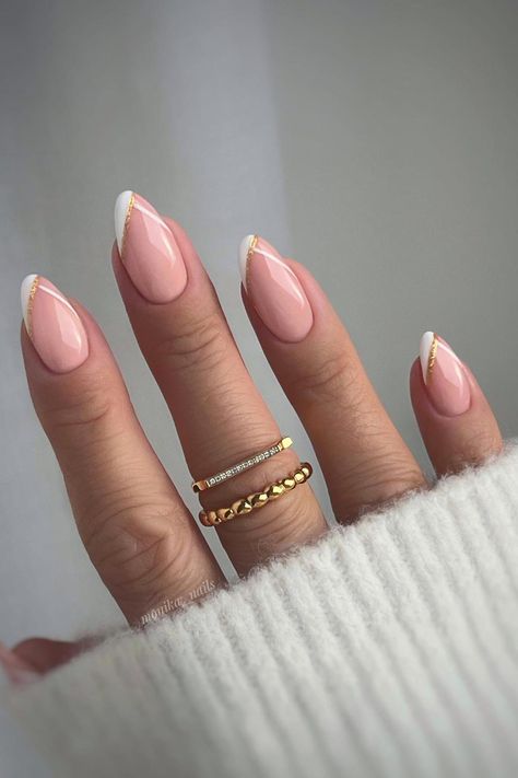 Timeless Glamour: Almond-shaped nails in delicate pale pink embrace sophistication, harmonized with a diagonal white French tip adorned with a touch of gold foil, radiating subtle luxury. // Photo Credit: Instagram @monika__nails Paznokcie Hello Kitty, Almond Gel Nails, Sophisticated Nails, Natural Nails Manicure, Chic Manicure, Kutek Disney, Natural Nail Designs, Manikur Kuku, French Tip Nail Designs