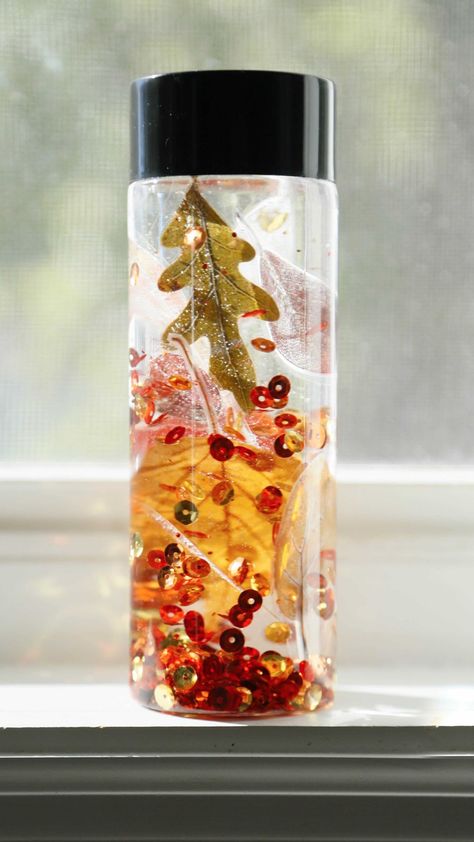 whatsinourbin on Instagram: 🍁 Fall Sensory Bottle 🍂 We used water, sequins and laminated leaves to make a fall so sensory bottle that is absolutely mesmerizing 😍… Calming Bottle, Fall Sensory, Sensory Bottle, Sensory Input, Sensory Bottles, Autumn Flowers, Bottle Lights, Bottle Sizes, Fall Flowers