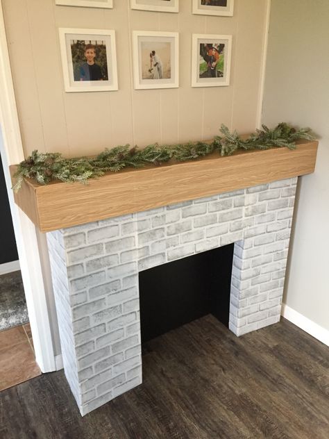 DIY fireplace from cardboard Fireplace Diy Cardboard, Faux Fireplace Diy Cardboard, Mantle Decor Diy, Cardboard Arcade, Faux Fireplaces, Diy Christmas Fireplace, Photoshoot Set, Cardboard Fireplace, Faux Fireplace Mantels