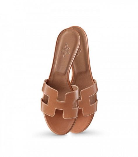 Hermes Oran Sandals in Tan LeatherSandal in Box calfskin with iconic "H" cut-out. An iconic Hermes style, this silhouette is an essential piece in every wardrobe. Purchase Worn by Crown Princess Mary on:July 2017 - Summer Holidays in GreeceAugust 2021 - Summer Holidays 2020 Shoes, Hermes Oran Sandals, Luxurious Bags, Wardrobe Wishlist, Shoe Wishlist, Hermes Oran, Hermes Handbags, Brown Sandals, Dream Shoes