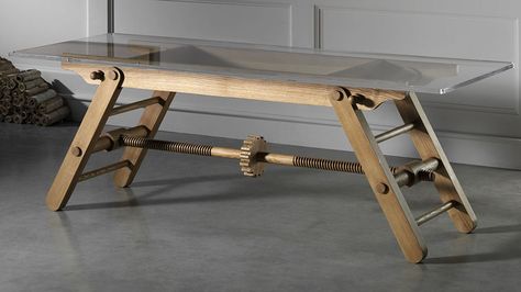 Height adjustable table. " my instinct would be to get down on all fours and crank that large gear in the middle by hand, to drive the threaded wooden rods and bring the legs closer together or further apart." Types Of Coffee Tables, Height Table, Adjustable Height Table, Traditional Table, Adjustable Table, Retail Furniture, Solid Wood Furniture, Repurposed Furniture, Wood Dining Table