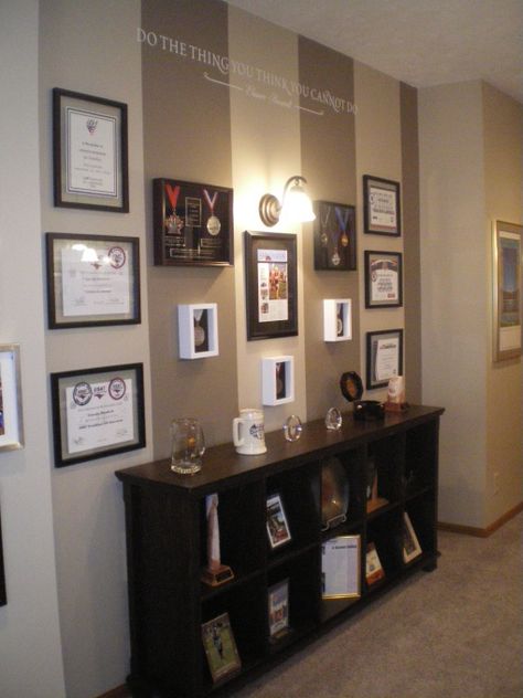 trophy display Wall Of Certificates Decor, Army Awards Display Wall, How To Display Awards And Certificates, Certification Wall Display, Awards Wall Display Ideas, Office Certificate Wall Display, Certificate Wall Display Ideas Office, Awards Display Ideas, Award Wall Display Ideas