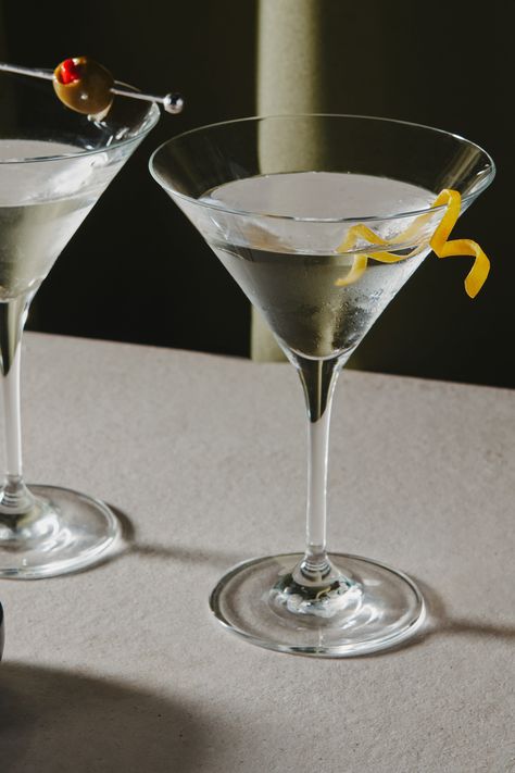 Like its gin-forward predecessor, the vodka martini cocktail recipe is endlessly customizable. Tweak the ratio of vodka to vermouth for a wet or dry martini; split the dry vermouth with sweet vermouth to make a “perfect martini” with vodka; season orange bitters and finish with a twist of lemon peel; add a splash of olive juice to make it a dirty martini—if you go for olive brine, ditch the lemon twist and garnish with fat green olives instead. Serve in a chilled martini glass or coupe. Vodka Martini With A Twist, Gin Martini With A Twist, Martini With A Twist, Slow Cooker Bean Soup, 21st Sign, Dirty Martini Recipe, School Moodboard, Mango Vodka, Martini Recipes Vodka