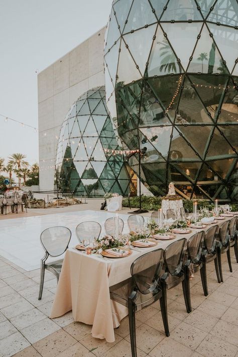 Romantic, Modern Wedding Reception Decor, Long Tables with Blush Pink Linens, Gold Chargers, Clear Black Acrylic Ghost Chairs, Greenery Garland Table Runner, Candlesticks and String Lights Over Dance Floor | Tampa Bay Wedding Planner UNIQUE Weddings + Events | Downtown St. Pete Wedding Venue The Dali Museum | Wedding Rentals A Chair Affair | Wedding Linens Over the Top Rental Linens Acrylic Wedding Chairs, Ghost Chair Wedding, Tampa Wedding Venues, Museum Wedding Reception, Romantic Modern Wedding, Garland Table Runner, Black Weddings, Dali Museum, Moss Wedding