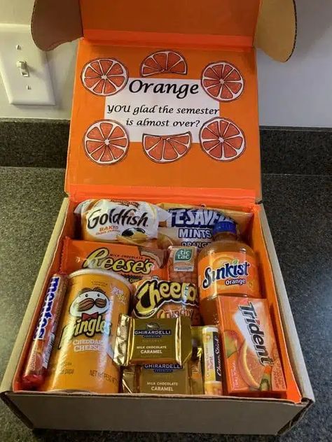 Care packages for college students Orange Gift Box Ideas, Orange Gift Basket, Care Packages For College Students, Orange Gift Box, College Gift Baskets, College Dorm Gifts, College Snacks, Snack Gift Baskets, Graduate High School