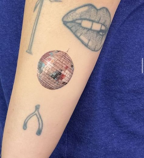 #CoolTattoos #TattooArt #InkMaster #TattooDesigns #InkedUp #TattooLovers #InkInspiration #TattooIdeas #CreativeInk #TattooStyle Disco Saturn Tattoo, Colorful Disco Ball Tattoo, Disco Ball Moon Tattoo, Disco Ball Tattoo Color, Melting Disco Ball Tattoo, Red Watercolor Tattoo, Disco Ball Cherry Tattoo, Tiny Disco Ball Tattoo, Cherry Disco Ball Tattoo