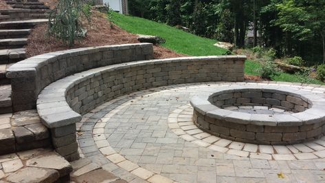 20' round paver patio. Weston retaining wall for fire pit and sitting wall Outdoor Fire Pit Area, Backyard Seating Area, Patio Pavers Design, Sloped Yard, Fire Pit Landscaping, Sloped Backyard, Landscaping Retaining Walls, Outdoor Patio Set, Patio Planters