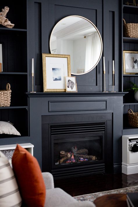 Craftberry Bush | Dark Built-in Shelves | https://www.craftberrybush.com Dark Painted Fireplace Surround, Dark Fireplace Mantle Decor, Dark Fireplace Surround, Black Blue Paint Color, Dark Mantle Fireplace, Ivy Fireplace, Dark Grey Blue Paint, Blue Fireplace Surround, Masculine Fireplace