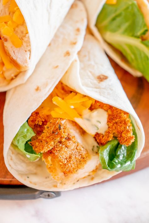 Wendys Spicy Chicken Wrap, Spicy Chicken Wrap Recipes, Fried Chicken Wraps, Wendys Spicy Chicken, Spicy Chicken Wrap, Buffalo Chicken Strips, Spicy Chicken Tenders, Asiago Chicken, Crispy Chicken Wraps