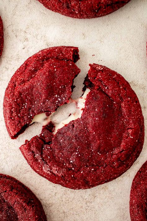 These thick, soft and chewy stuffed red velvet cream cheese cookies have the best flavors of red velvet cake. Stuffed with a tangy, fluffy cream cheese frosting, these cookies are perfect for a gift, cookie swap or holiday event. Red Velvet With Cream Cheese Frosting, Red Velvet Cookies With Cream Cheese Filling, Red Velvet Cookies From Cake Mix Easy Cream Cheese, Soft Red Velvet Cookies, Cream Cheese Stuffed Red Velvet Cookies, Christmas Stuffed Cookies, Holiday Cookie Flavors, Red Velvet Stuffed Cookies, Red Velvet Christmas Cookies