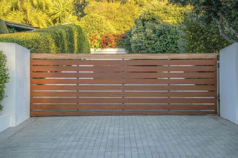 20 Driveway Gate Ideas to Suit Every House Style — The Spruce Wooden Driveway Gate Ideas, Modern Gated Driveway Entrance, Privacy Gates Driveway Entrance, Driveway Gate Ideas, Sliding Gate Ideas, Entrance Gates Driveway, Gates Driveway, Wooden Gates Driveway, Gate Ideas