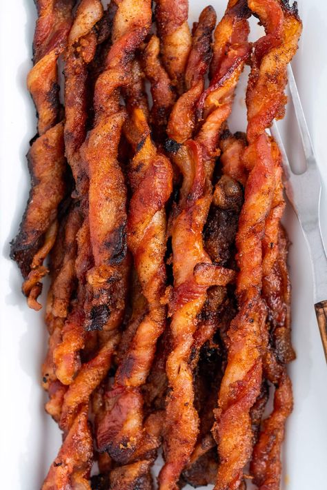 These bacon twists are sweet and savory with caramelized brown sugar and a bit of heat from a sprinkle of cayenne pepper. Buckle up for one of the best new methods of cooking bacon! Carmelized Bacon, Bacon Twists, Methods Of Cooking, Candied Bacon Recipe, Oven Baked Bacon, Bacon Roll, Brown Sugar Bacon, Bacon Appetizers, Pork Bacon