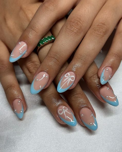 Baby Blue Bow Set 🎀🩵 • • • Apres Natural Almond Medium • IGel (I’m Blushing) • • #nails #nailsnailsnails #nailsofinstagram #nailsart #nailsbyavryl #gelx #gelxnails #gelxnailtech #explorepage #frenchtipnails #almondnails Baby Blue Xmas Nails, Baby Blue Bow Nails, Short Almond Birthday Nails, Baby Shower Blue Nails, Light Blue Bow Nails, Baby Blue Acrylic Nails Almond, Almond Acrylic Nails Blue, Short Blue Almond Nails, Almond Nails Baby Blue