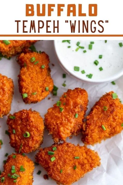 In need of a vegetarian appetizer? This recipe for Buffalo Tempeh “Wings” is crispy chunks of tempeh baked (or fried) to perfection and coated in spicy buffalo sauce. Serve these tempeh “wings” with ranch dip for the ultimate party snack! This is a unique and unexpected appetizer that can be baked or fried, and is packed with so much flavor. Add some celery sticks, and a traditional dip like vegan ranch or blue cheese, and you’ve got a game day or anytime snack that’s sure to get rave reviews! Buffalo Tempeh, Crispy Tempeh, Spicy Tempeh, Smoked Tempeh Recipe, Vegan Blue Cheese Dressing, Honey Garlic Tempeh, Homemade Vegan Ranch Dressing, Vegan Apps, Paleo Appetizers