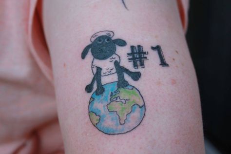 Tattoo of a lady who's broken the world record for "largest collection of sheep collectibles"!! Black Sheep Of The Family, Shaun The Sheep, My Tattoo, World Record, Black Sheep, World Records, A Lady, Paw Print Tattoo, I Tattoo