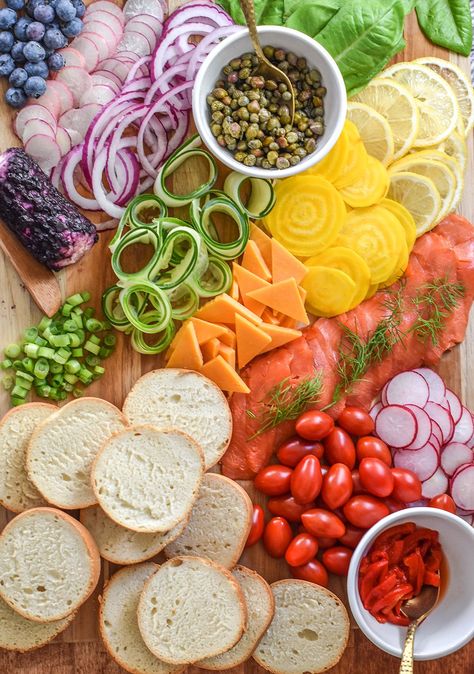 Delicious and absolutely beautiful, why not create a brunch charcuterie board with all the colors of the rainbow? I included salmon lox, Rhodes® Warm & Serve rolls, and all our favorite toppings to make this gorgeous board. Rainbow Brunch, Brunch Charcuterie Board Ideas, Rainbow Charcuterie Board, Rainbow Charcuterie, Brunch Charcuterie Board, Rainbow Fruit Platters, Brunch Charcuterie, Salmon Lox, Rainbow Snacks