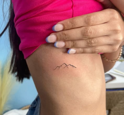 Mountain Side Tattoo, Dainty Tattoos Mountains, Mountain Life Tattoo, Mountain Tattoo Dainty, Dainty Mountain Tattoo Simple, Mountain Mama Tattoo, Coors Mountain Tattoo, Rib Mountain Tattoos For Women, Ribcage Mountain Tattoo