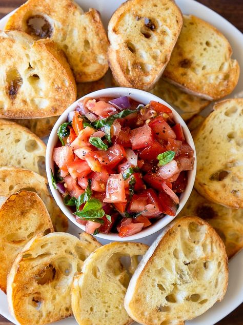 Small white bowl filled with tomato salad and toasted bread slices all around. Buffalo Chicken Dip Easy Recipes, Easy Bruschetta Recipe, Toasted Baguette, Easy Bruschetta, Quick Appetizer, Easy Teriyaki Chicken, Baguette Bread, Bruschetta Ingredients, Chicken Teriyaki Recipe