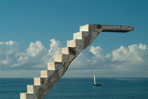 Southern Africa. Mozambique. Ilha de Mocambique. Stone town. Dhows passing abandoned concrete staircase and diving board from abandoned Portuguese swimming pool. Ilha De Mocambique, Mozambique, Southern East Africa. Olympic Diving, Diving Springboard, Double Indemnity, Diving Boards, Concrete Staircase, Sea Diving, Stone Town, Diving Board, Bad Art