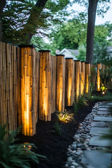 Bamboo fence with solar lights backyard privacy seating section. Discover creative bamboo privacy fence ideas that will transform your outdoor space into a secluded paradise. Solar Lights Backyard, Bamboo Privacy Fence, Lights Backyard, Backyard Solar Lights, Privacy Fence Ideas, Bamboo Privacy, Backyard Privacy, Patio Fence, Privacy Fences