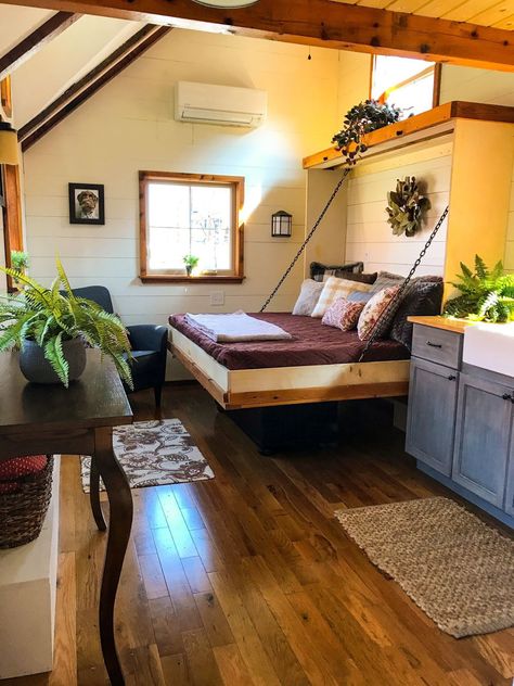 This is the Highland Home. It’s a 10ft wide by 24ft long tiny home on wheels built by Incredible Tiny Homes out of Morristown, Tennessee featuring a thatched roof and window flower boxes. The… Apartemen Studio, Rustic Tiny House, Tiny House Interior Design, Best Tiny House, Tiny House Inspiration, Furniture Handmade, Casa Container, Tiny House Decor, Tiny House Movement