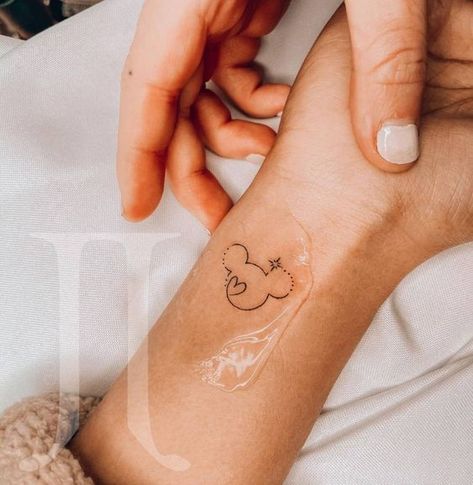 Mickey Tattoo. Disney Tattoos Wrist, Ankle Tattoo Disney, Discrete Disney Tattoos, Mini Mickey Tattoo, Small Disneyland Tattoos, Minnie Mouse Wrist Tattoo, Mickey Mouse Tattoo Minimalist, Disney Tiny Tattoo Ideas, Dainty Mickey Mouse Tattoo