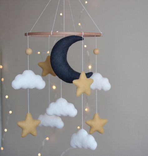 Hanging felt mobile with moon ,  stars and clouds . Best present for your new child or for a baby shower.The parts could be changed and a completely new one can be added. All toys are specially designed and handmade for bringing color and tenderness to the Baby's Room. Made with eco-friendly polyester felt and wool blend felt of the highest quality.Individual design is possible.  You can request your preferred palette color if item doesn't match your nursery. Just ask me if you want to change an Moon Crib, Star Themed Nursery, Crib Decoration, Stars Baby Mobile, Baby Mobile Felt, Diy Baby Mobile, Mobile Crib, Moon Nursery, Star Mobile