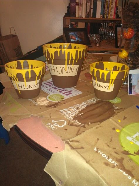 Birthday hunny pots for Winnie the Pooh birthday party! Centerpieces Winnie The Pooh, Honeycomb Backdrop, Diy Winnie The Pooh, Winnie The Pooh Nursery Decor, Pooh Bear Party, Winnie The Pooh Birthday Party, Pooh Birthday Party, Hunny Pot, Kids Birthday Party Decorations