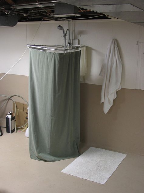 Temporary Shower Temporary Shower In Basement, Temporary Shower Ideas, Portable Shower Stall, Unfinished Basement Laundry, Small Shower, Black Grout, Basement Laundry, Portable Shower, Wood Kitchen Island