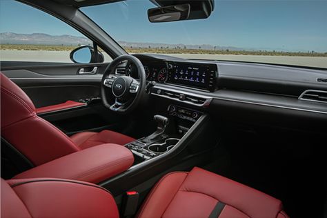 The all-new 2021 Kia K5 offers a mix of premium and sporty upholstery options including red leatherette seating, satin chrome metallic and wood-like finishes on the dashboard and door panels (depending on trim). Kia K5 Gt Line, K5 Gt Line, Red Interior Car, Mid Size Sedan, Kia K5, Kia Stinger, Luxury Vehicles, Driving Games, Kia Motors